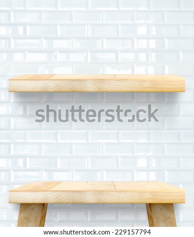 Empty Wooden Table top and shelf at white tile ceramic wall,Template mock up for display of your product