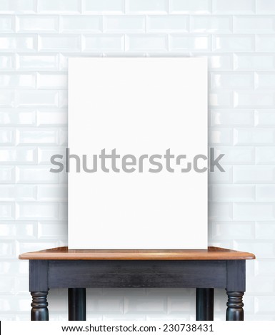 Blank white poster banner standing on vintage wooden table at ceramic tiles wall, Mock up template for present business concept.