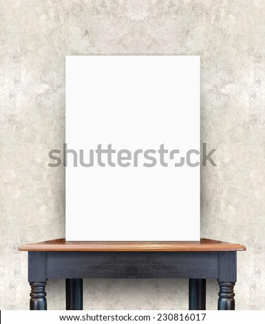 Blank white poster banner standing on vintage wooden table at concrete wall, Mock up template for present business concept.