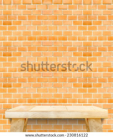 Empty Wooden Table top orange bricks wall,Template mock up for display of your product
