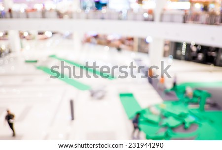 Blurred background : Staff set up the booth of event in department store