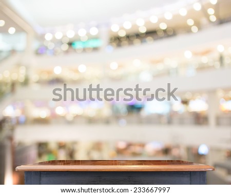 Empty Black vintage table top at store blurred background with bokeh light,Template mock up for display of your product.