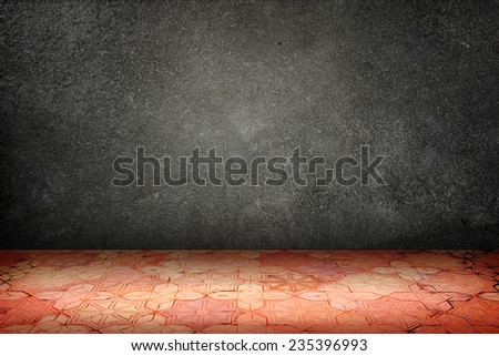 Empty room with black stone wall and vintage pattern brick block floor,Template Mock up for display of your content