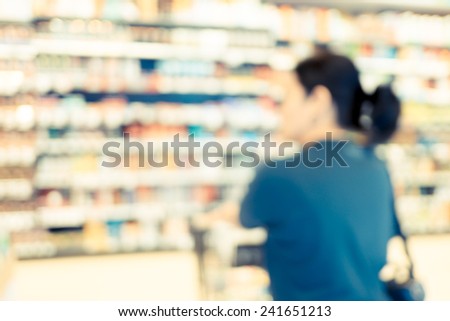 Blurred background : vintage filter Supermarket store blur background with bokeh