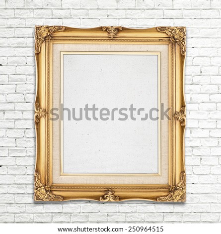 Blank Gold Vintage photo frame on white brick wall, Template for adding photo.