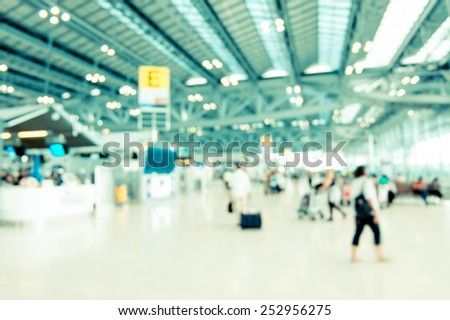 Blurred background : Traveler at airport terminal blur background with bokeh light,Vintage filter