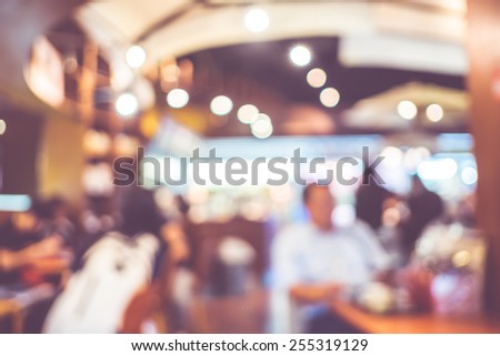 Blurred background : Vintage filter Customer sitting in Coffee shop blur background with bokeh