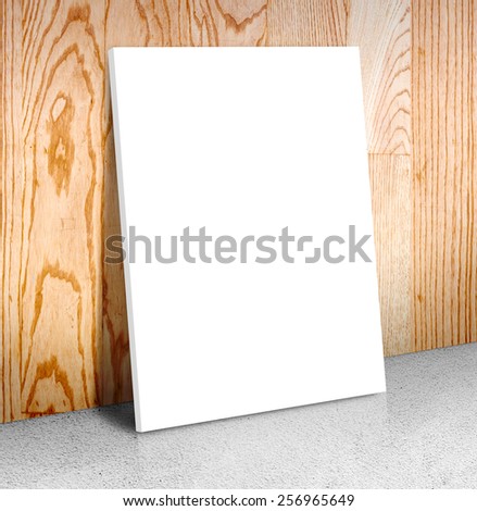 Blank white poster frame at concrete floor and wooden wall, Canvas frame template Business concept
