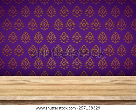 Empty table top with purple wallpaper with Thai pattern wall,Template mock up for display of product.