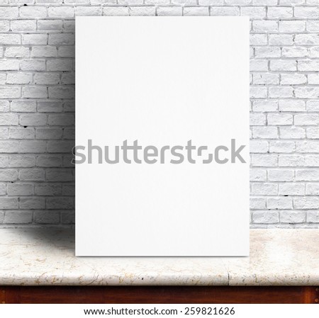 Black White paper poster lean at white brick wall and marble table,Template mock up for adding your text