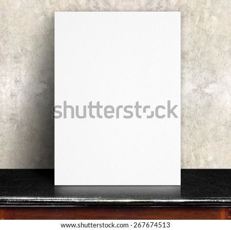 Black White paper poster lean at concrete wall and black marble table,Template mock up for adding your text.