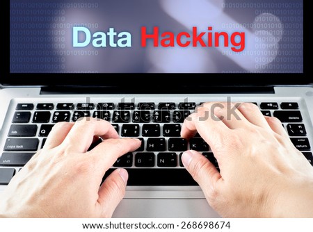 hand type on laptop with data hacking on screen with blur background, internet security concept.
