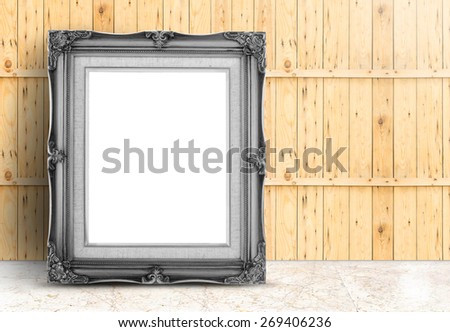 Blank black Vintage frame on marble floor and plank wooden wall,Template mock up for adding your design