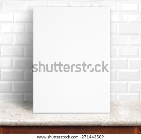 Black White paper poster lean at white ceramic tiles wall and marble table,Template mock up for adding your design.