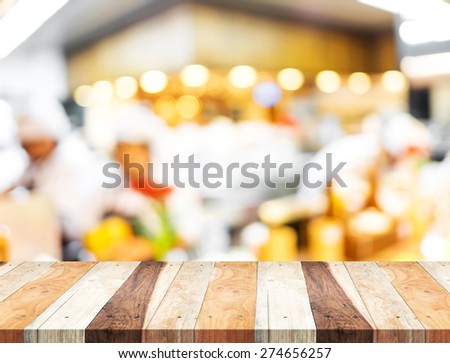 Empty wood table and blurred restaurant light background. product display template.Business presentation.