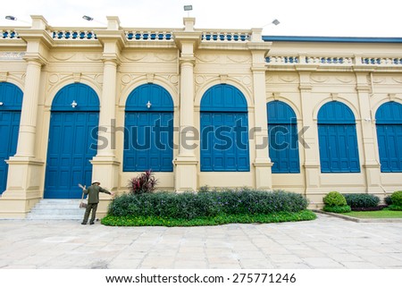 Landscape of Blue door with roman style at Grand Palace Thailand and cleaner officer