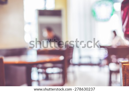 Blurred background : People in Coffee shop blur background with bokeh light with vintage filter.