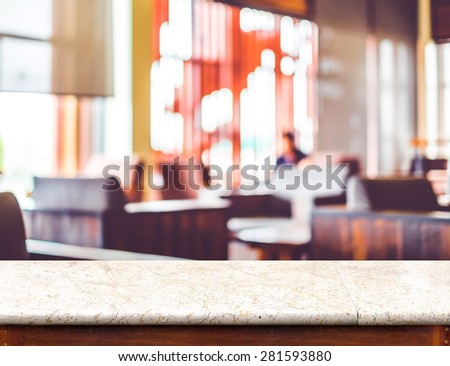 Empty marble table top and blurred coffee shop bokeh light in background, Mock up for display of product