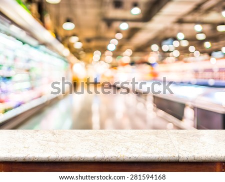 Empty marble table top and blurred supermarket bokeh light in background, Mock up for display of product