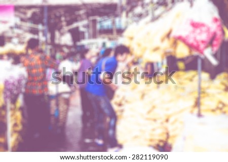 Blurred background : people shopping at flower market fair, blur background with bokeh.