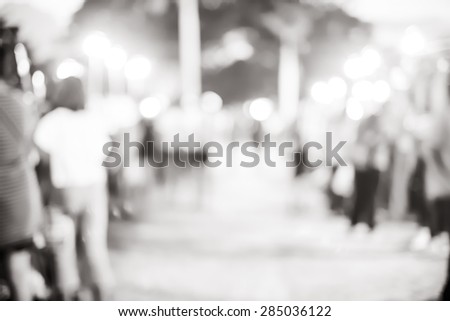 Blur background :Outdoor night market fair with bokeh light, black and white filter.