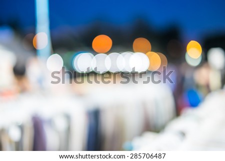 Blur background :Outdoor night market fair with bokeh light.