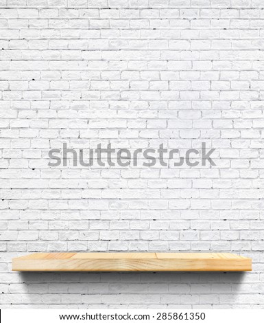 Empty Wooden shelf at white tile ceramic wall,Template mock up for display of product,business presentation.