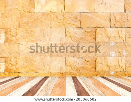 Empty perspective room with sand stone wall and wooden plank floor,Template mock up for display of your product.