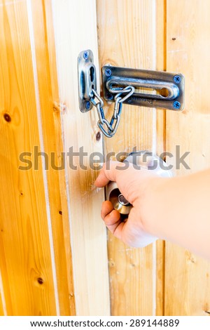Hand opening door knob door at wooden room