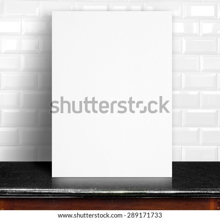 Black White paper poster lean at white ceramic tiles wall and marble table,Template mock up for adding your design