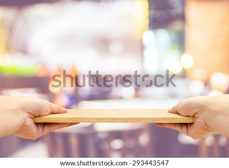 Two hand holding food plate made from wood isolated on white background, Template mock up for adding your product and leave space for adding content , Clipping path on object