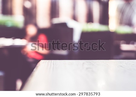 Blur background,Empty wood table at restaurant,Mock up for display of product.