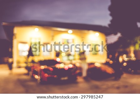 Blur background :Outdoor home at night with bokeh light.