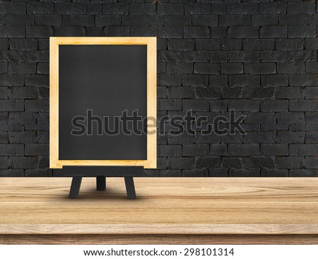 Menu blackboard on  Wooden Table top at black brick wall,Template mock up for display of your product,Business presentation.