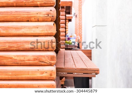 Close up log wood food stand at street.