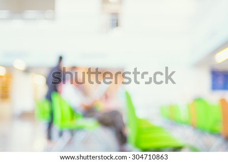blur background : business man reading newpaper in building