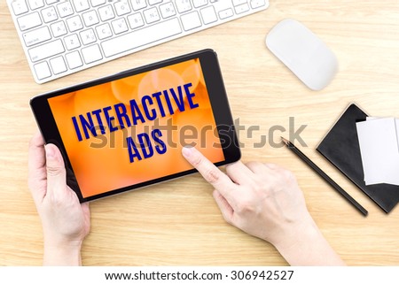 Finger click screen with Interactive ads word with keyboard on wooden table,Food business design concept