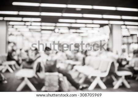 Blur background : Passenger waiting for flight at airport gate blur background with bokeh light.