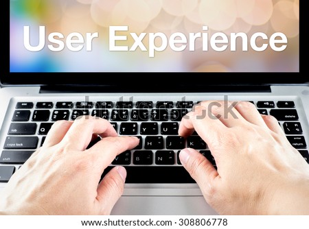 User experience word on laptop screen with hand type on keyboard, Digital Marketing concept