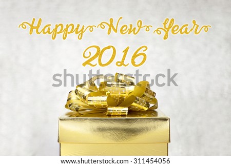 Golden Present box with Happy New Year 2016 word at bokeh light background, Holiday concept.
