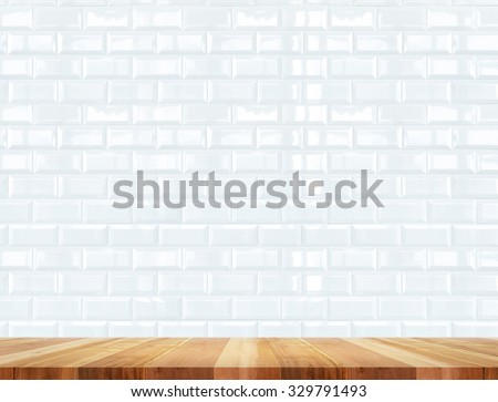 Empty wood table and ceramic tile brick wall in background,Mock up for display of product