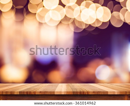 Empty perspective wood plank table top with abstract bokeh light background,Mock up for montage of your product