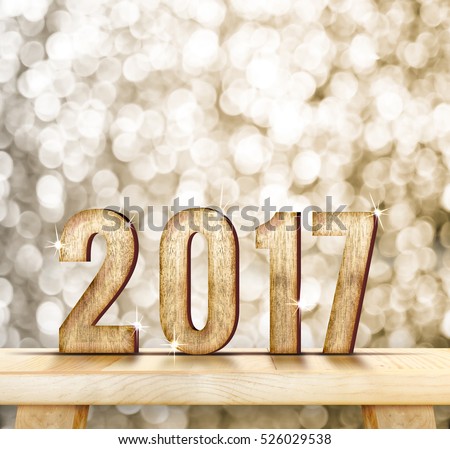 2017 year wood number on wood table with gold sparkling bokeh wall and wooden plank floor,leave space for adding your content