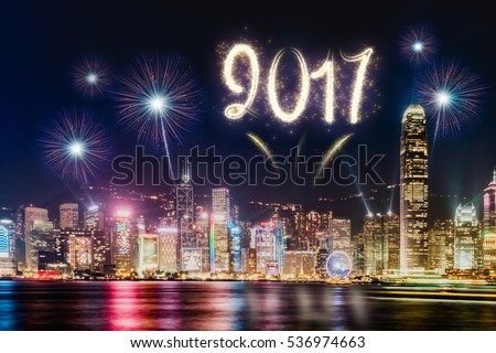 2017 firework over cityscape building near sea at night time celebration,Happy new year countdown.