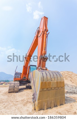 excavator machine at excavation earthmoving work in sand
