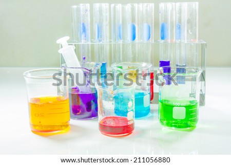 Lab equipment, glassware kit filled with various colored liquids