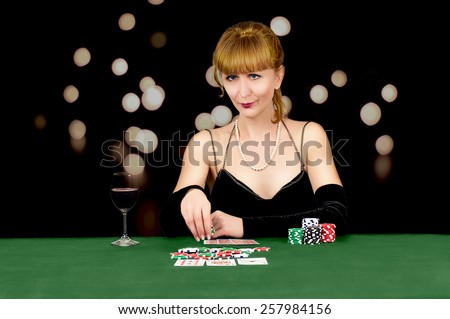 girl with card for game table in casino