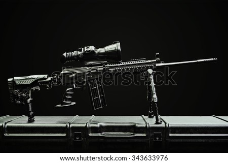 sniper rifle on the case on the dark background