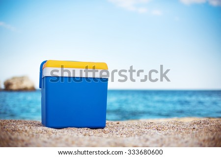 Cooler box on the sea sand