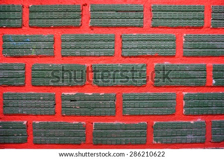 Green Block on Red Wall